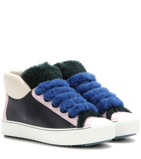 fendi shearling trimmed sneakers.